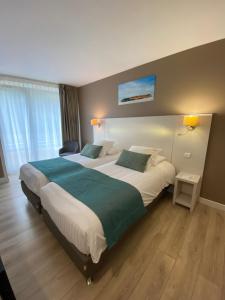 Postel nebo postele na pokoji v ubytování Best Western Plus Hôtel la Rade