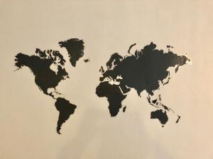 a drawing of a world map on a wall at Stylish Apartment With Secure Parking Close to City in Chester