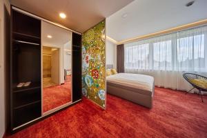Łóżko lub łóżka w pokoju w obiekcie Hotel Hertz