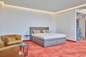 Łóżko lub łóżka w pokoju w obiekcie Hotel Hertz