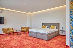 Łóżko lub łóżka w pokoju w obiekcie Hotel Hertz