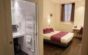 Un ou plusieurs lits dans un hébergement de l'établissement Hotelo Lyon Ainay