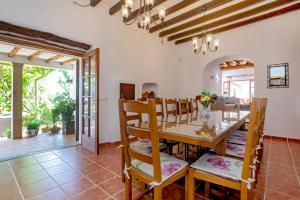 a kitchen and dining room with a table and chairs at Villa Near Ibiza Town - San Antonio Sleeps 14 in San Jose