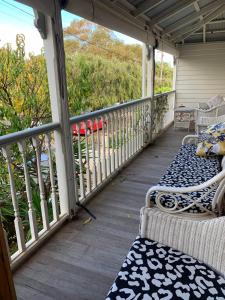 
a porch view of a porch with a view of a balcony at Arundels Boutique Accommodation in Fremantle
