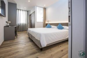 Giường trong phòng chung tại Albergo Cappello e Cadore