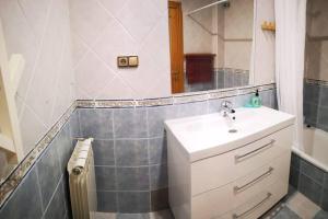 a bathroom with a sink and a mirror at Casa La Lonja de Guadix in Guadix