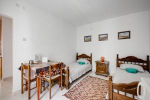 Letto o letti in una camera di Villa Dionis
