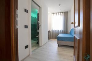 Giường trong phòng chung tại Albergo Cappello e Cadore