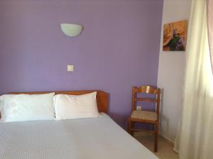 Кровать или кровати в номере Pansion Eleni