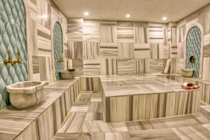 a bathroom with a tub and a sink at Sirkeci Ersu Hotel & SPA in Istanbul +164 photos