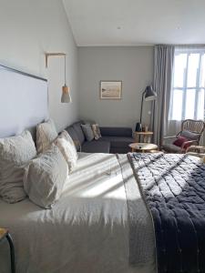 Кровать или кровати в номере Les Chambres de l'Imprimerie