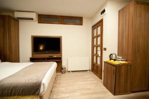 Postel nebo postele na pokoji v ubytování Ferman Konak Hotel-Special Category