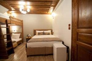 Postel nebo postele na pokoji v ubytování Ferman Konak Hotel-Special Category