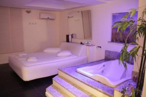 Postel nebo postele na pokoji v ubytování Motel KamaSutra