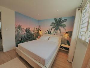 Rúm í herbergi á Kozycoco - Suite Coco - votre séjour tropical au calme