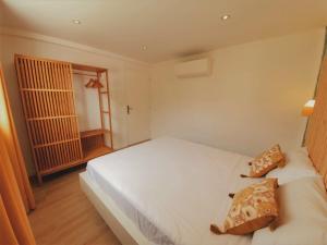 Letto o letti in una camera di Kozycoco - Suite Kozy - séjour tropical au calme