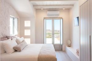 Postel nebo postele na pokoji v ubytování Bellevue Villas