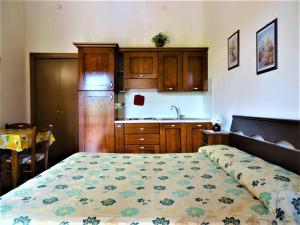 Kuchyň nebo kuchyňský kout v ubytování Vecchio Faro Residence