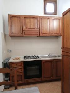 A kitchen or kitchenette at Vecchio Faro Residence