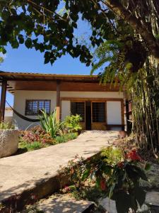 a house with a pathway in front of it at Casa com vista verde in Ouro Preto