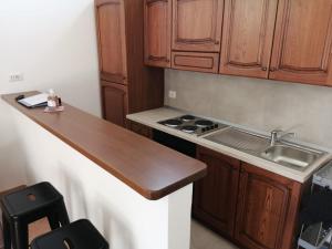 A kitchen or kitchenette at Vecchio Faro Residence