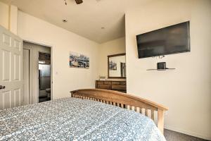 a bedroom with a bed and a flat screen tv at Sunny SoCal Escape about 5 Mi to Universal Studios! in Burbank