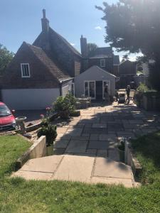 a house with a stone driveway in front of a house at Brooks House formerly The Red Lion in St Margarets at Cliff