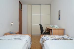 Łóżko lub łóżka w pokoju w obiekcie Apartman Lazy Summer Days
