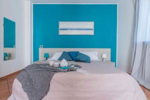 A bed or beds in a room at Villa Candelara