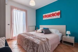 A bed or beds in a room at Villa Candelara