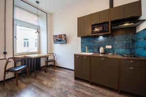 Kuchyň nebo kuchyňský kout v ubytování Secret Apartments