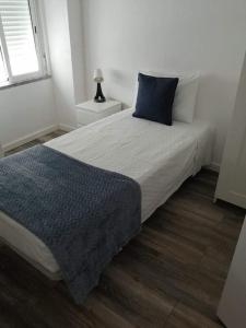 Un pat sau paturi într-o cameră la Casa das Histórias