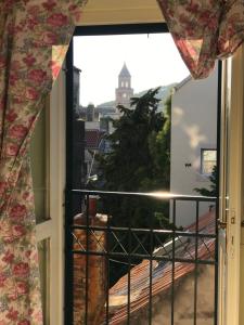 an open window with a view of a building at Studio in the top center in Split