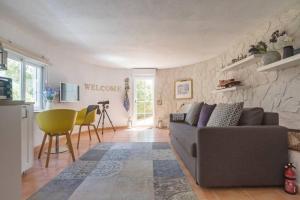 a living room with a couch and a table at Boutique Apartment Altea La Vella in Altea