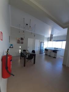 a large room with a table and chairs in it at Cantinho do Sonho in Maia