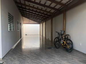 a bike parked in a hallway of a house at Casa Siqueira Nova Viçosa in Nova Viçosa