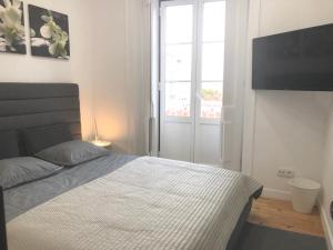 Кровать или кровати в номере Your Home in Bairro Alto