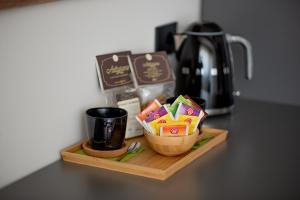 a counter top with a cup and a coffee pot at AriaRoom219 in Capurso
