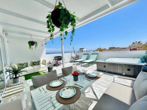 a living room with a view of the ocean at Villa Blanca Tenerife - Atico Loft in San Isidro