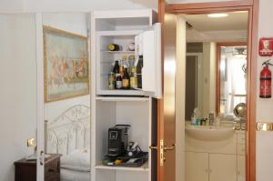 a bathroom with a sink and a mirror and a room with a sink at La casa di Luna in San Benedetto del Tronto +128 photos
