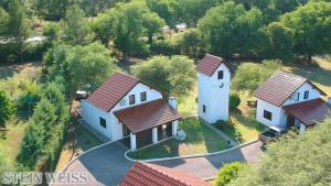 an aerial view of a house with red roofs at Cabañas Stein Weiss in Santa Rosa de Calamuchita