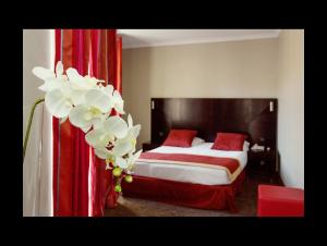 Postel nebo postele na pokoji v ubytování Hotel De Suède
