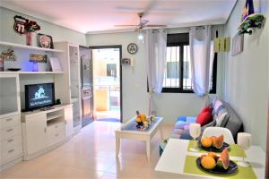 Televízia a/alebo spoločenská miestnosť v ubytovaní Apartment Paraiso