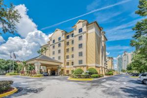 a rendering of the front of a hotel at 1BR with King Bed - Near Disney - Pool and Hot Tub! in Orlando