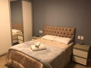 Ένα ή περισσότερα κρεβάτια σε δωμάτιο στο Belvedere Gramado