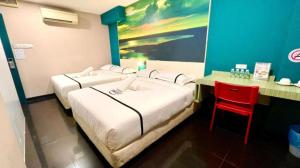 Letto o letti in una camera di Smile Hotel Chow Kit PWTC