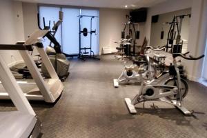 a gym with several treadmills and exercise bikes at Cozy Sweet Studio #7, 10 minutes to D.T. Ottawa in Gatineau