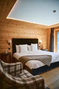 Postel nebo postele na pokoji v ubytování Hôtel de Rougemont & Spa