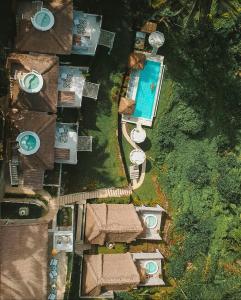 an overhead view of a resort with a swimming pool at Woywoy Escape Bresela Adults Only in Tegalalang