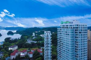 a view of a city with a tall building at Holiday Inn One Thousand Island Lake, an IHG Hotel in Chun'an